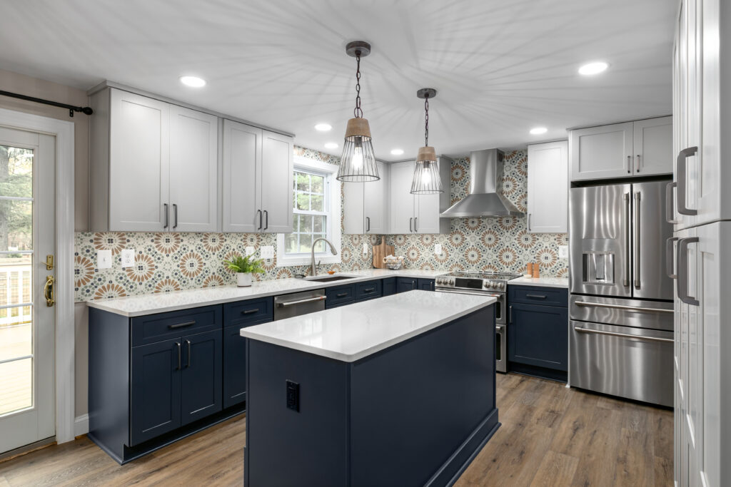 Custom indigo kitchen island with a drawer stack, built-in microwave, and seating overhang