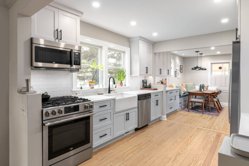 Flat-panel working wall with existing 30-inch gas range and vented over-range microwave hood