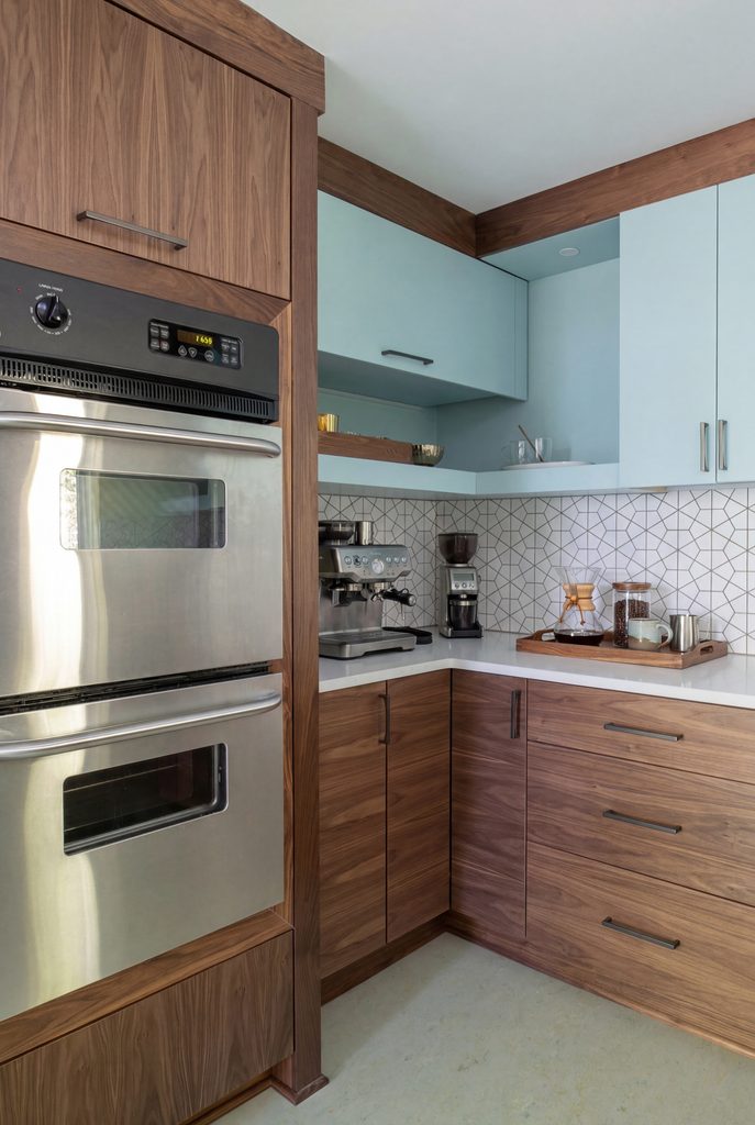 Tall walnut pantry wall with built-in wall ovens and refrigerator